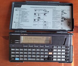 A TI-95 PROCALC in the plastic protective case on startup, with the alphanumeric display reading "TI-95 PROCALC." The cartridge slot protector bearing RAM/ROM is inserted into the cartridge slot at the top-right of the caculator.